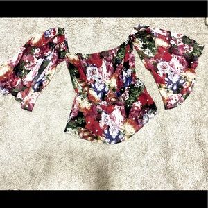 Floral off shoulder top. Gathered at waist.